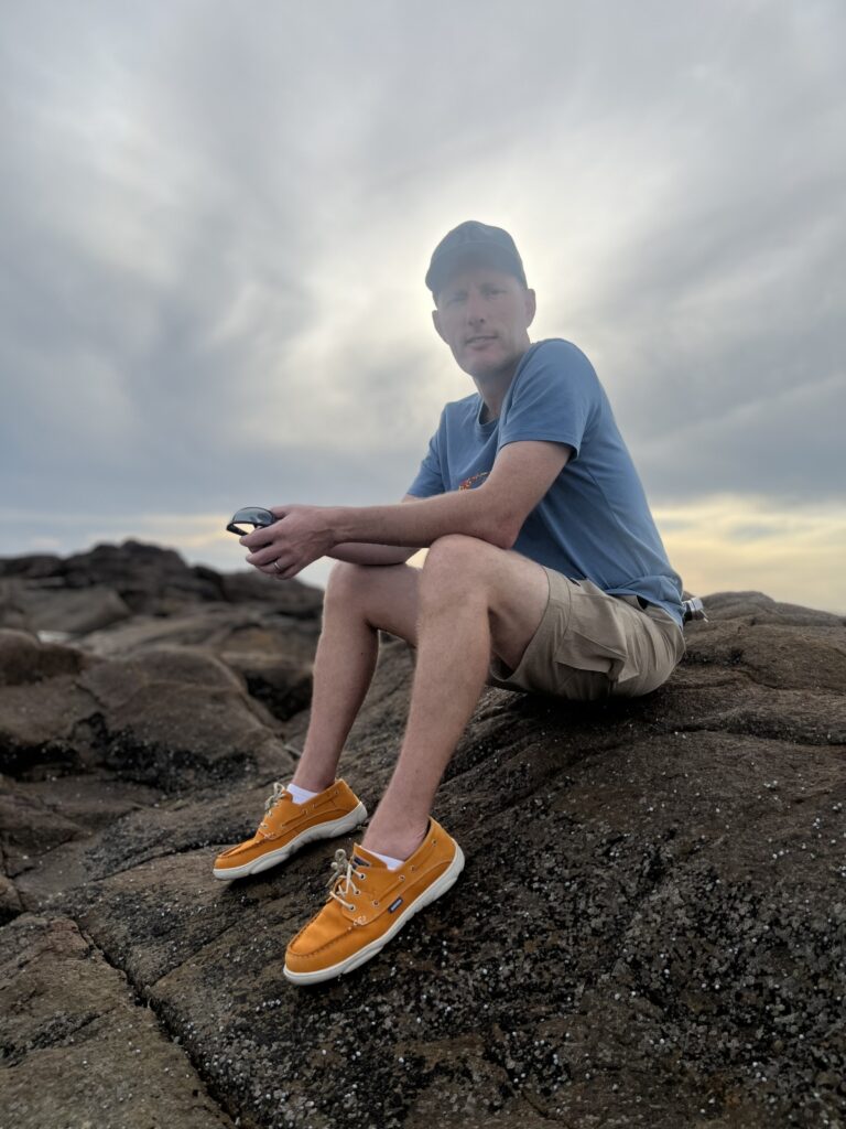 David Cocking sitting on a rock